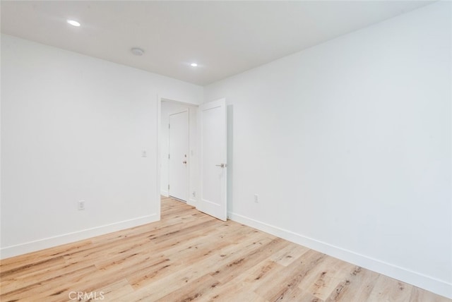 unfurnished room featuring light hardwood / wood-style flooring