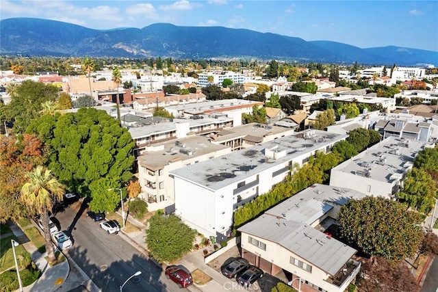 birds eye view of property featuring a mountain view