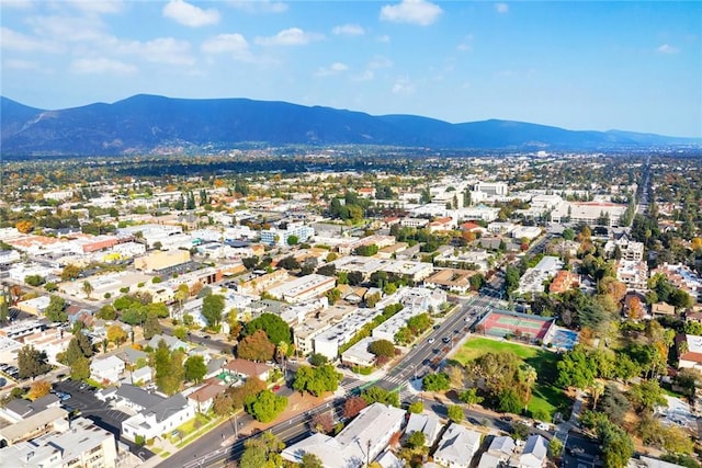 birds eye view of property with a mountain view