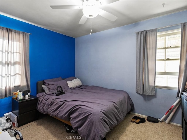 carpeted bedroom with ceiling fan