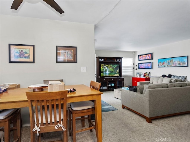 carpeted living room featuring ceiling fan