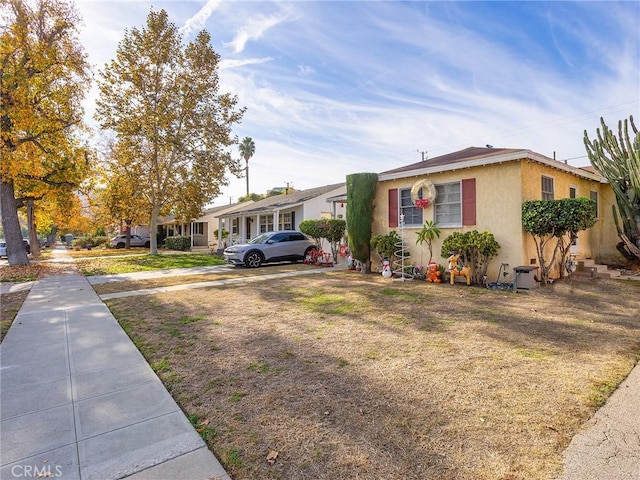 ranch-style house with a front yard