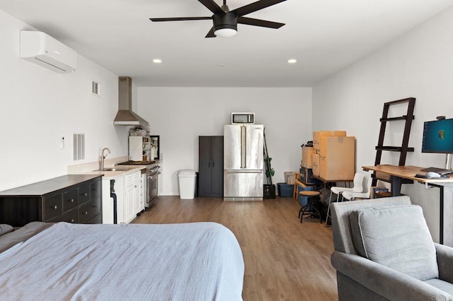 bedroom featuring a wall mounted AC, ceiling fan, high quality fridge, dark wood-type flooring, and sink