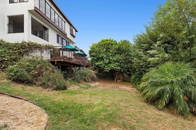 view of yard featuring a deck