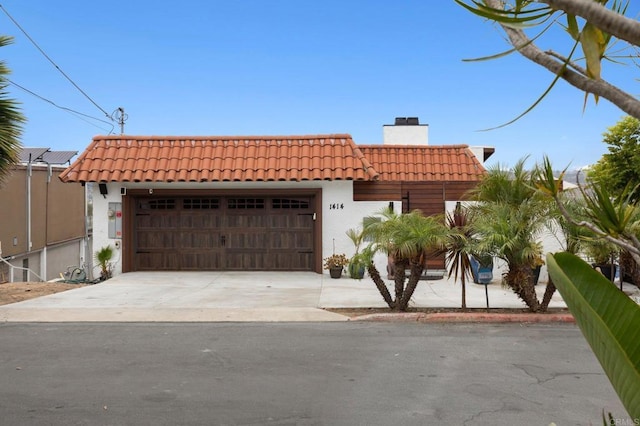 mediterranean / spanish-style house featuring a garage