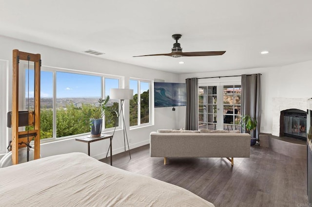 bedroom with ceiling fan and dark wood-type flooring