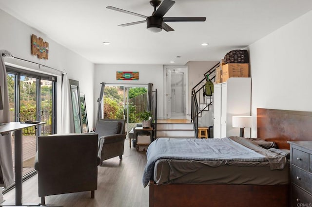 bedroom with ceiling fan and light hardwood / wood-style floors