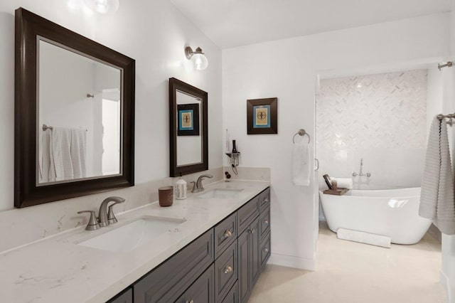 bathroom featuring a bath and vanity