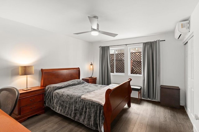 bedroom featuring ceiling fan, dark hardwood / wood-style flooring, and a wall mounted air conditioner