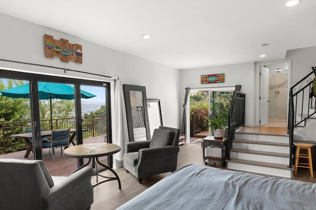 bedroom featuring access to outside, french doors, and hardwood / wood-style flooring