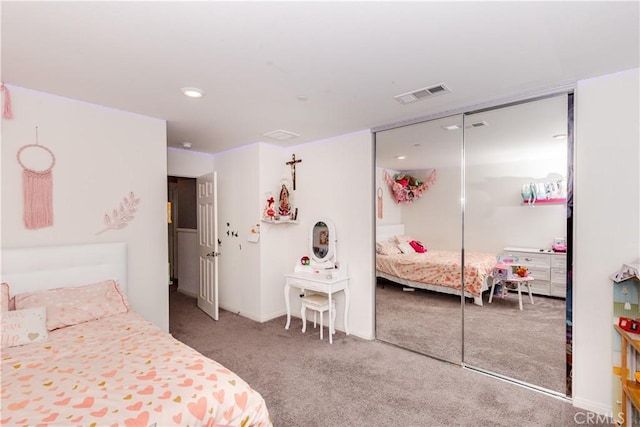 bedroom featuring visible vents, baseboards, a closet, and carpet flooring