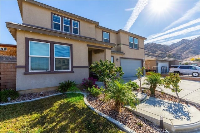 view of front of home featuring a mountain view and a garage