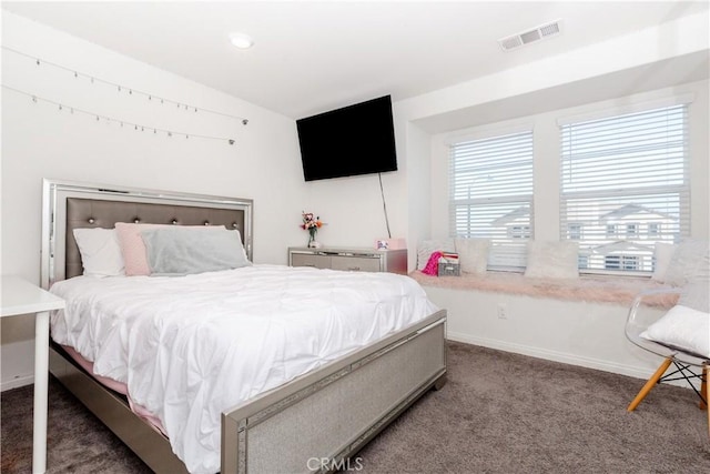 bedroom with carpet flooring, baseboards, and visible vents