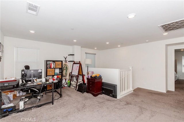 carpeted office space with recessed lighting and visible vents