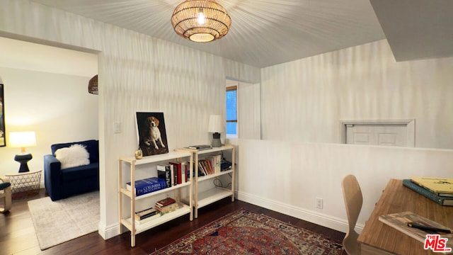 home office featuring a notable chandelier and dark hardwood / wood-style floors