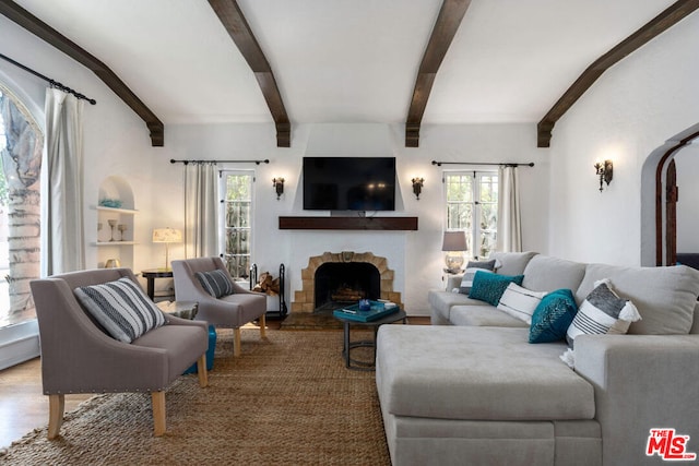 living room featuring wood-type flooring and beam ceiling