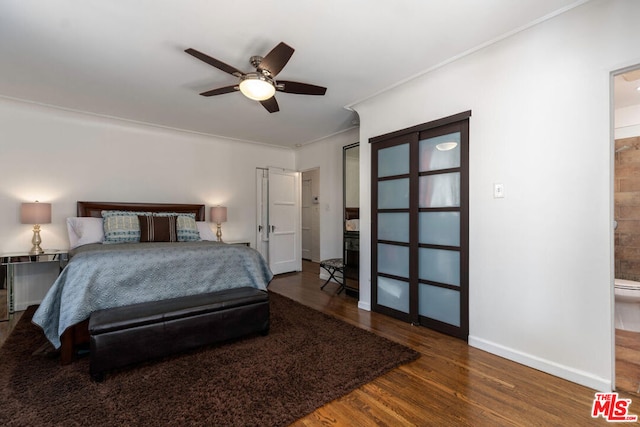 bedroom with ceiling fan and dark hardwood / wood-style flooring