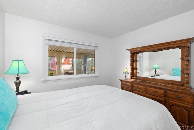 bedroom featuring a textured ceiling