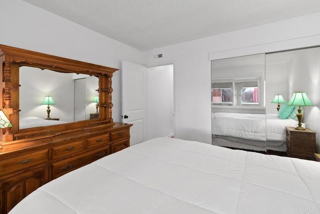 bedroom featuring a textured ceiling