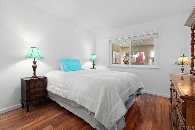 bedroom featuring dark wood-type flooring