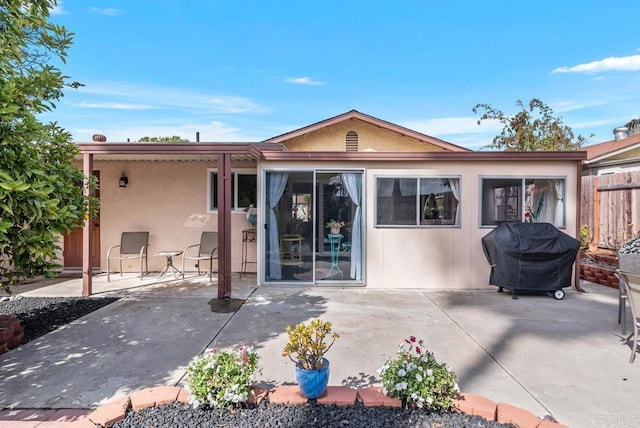 rear view of house featuring a patio area