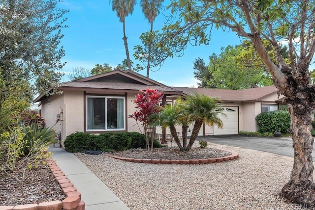 single story home featuring a garage