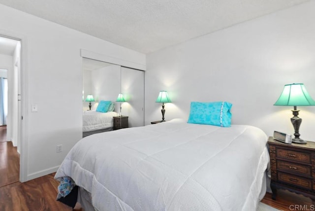 bedroom featuring hardwood / wood-style flooring and a closet