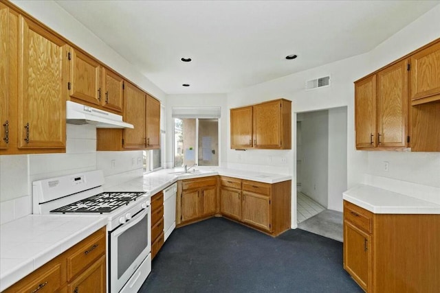 kitchen featuring sink and white appliances