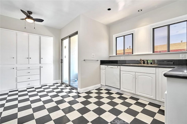 kitchen with dishwasher, white cabinets, ceiling fan, and sink