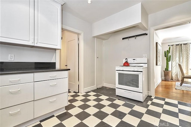 kitchen featuring white range oven, white cabinets, and dark hardwood / wood-style floors