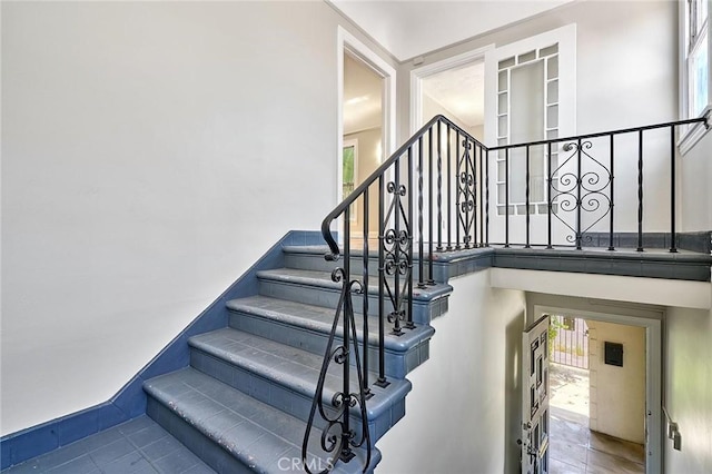 staircase with tile patterned flooring