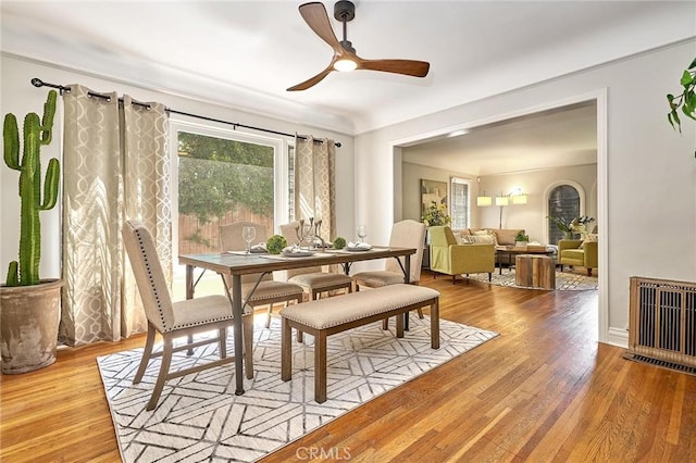 dining room with hardwood / wood-style floors and ceiling fan