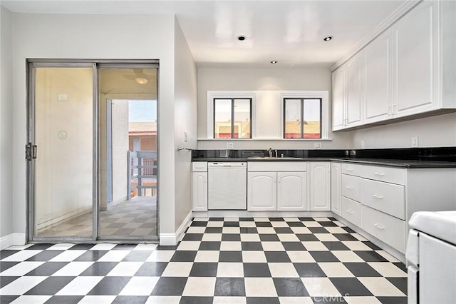 kitchen with white cabinets, white appliances, and sink