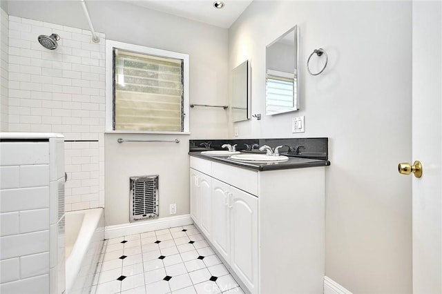 bathroom featuring vanity and tiled shower / bath combo