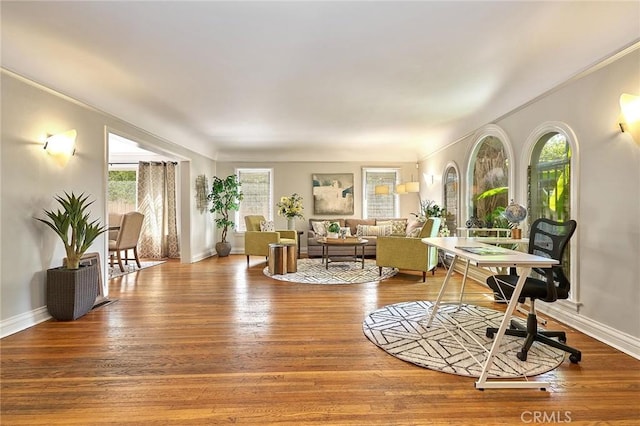 home office with plenty of natural light and wood-type flooring