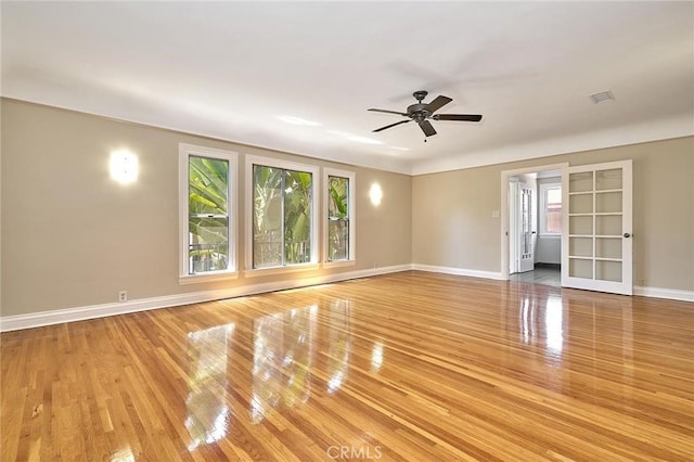 unfurnished room featuring hardwood / wood-style floors and ceiling fan