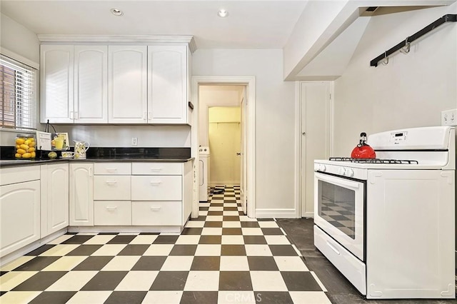 kitchen featuring white cabinetry and white range with gas stovetop