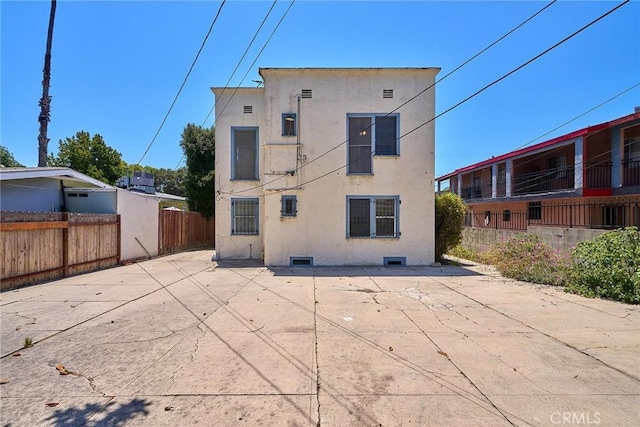 back of property with a patio