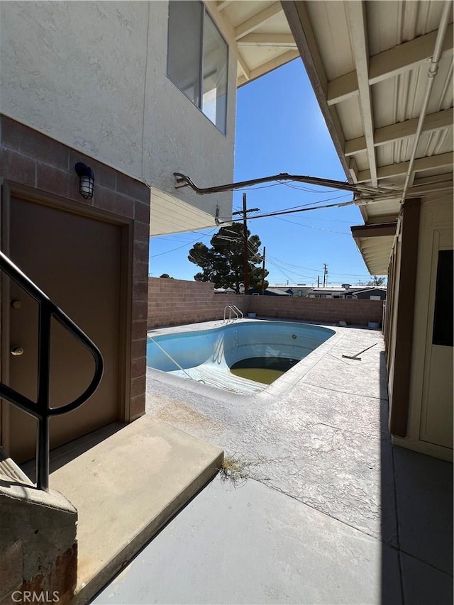 view of pool with a patio area, a fenced backyard, and a fenced in pool