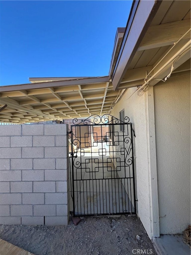 view of gate with fence