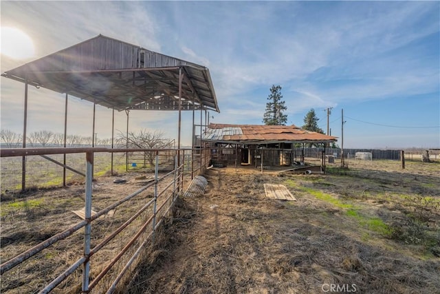 view of yard with an outbuilding and a rural view