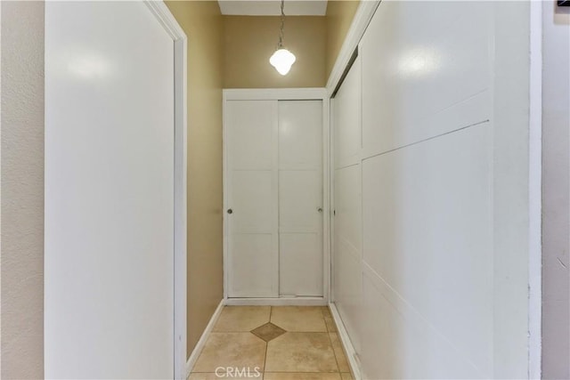 hallway with light tile patterned flooring