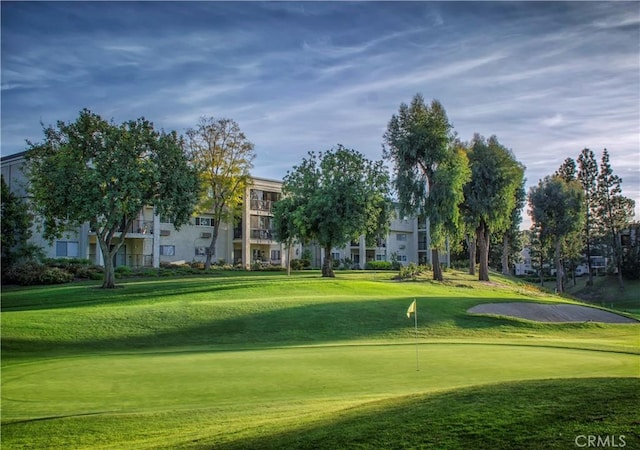 view of property's community with a lawn