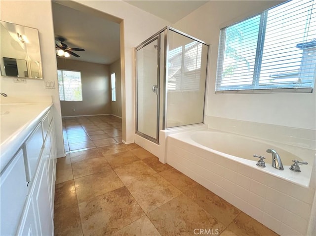 bathroom featuring tile patterned flooring, vanity, separate shower and tub, and ceiling fan