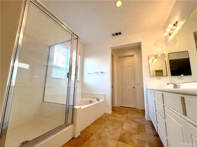 bathroom featuring separate shower and tub and vanity