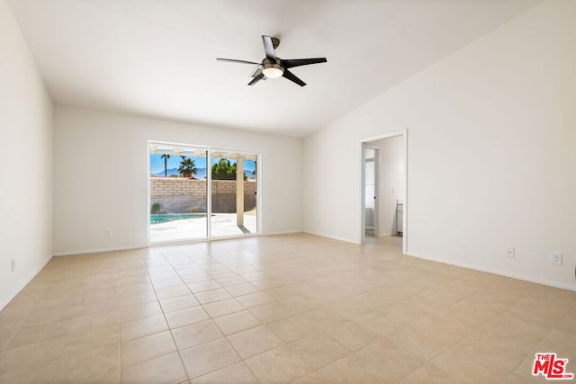 tiled spare room with ceiling fan and lofted ceiling