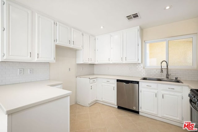 kitchen featuring backsplash, sink, stainless steel dishwasher, light tile patterned floors, and white cabinetry