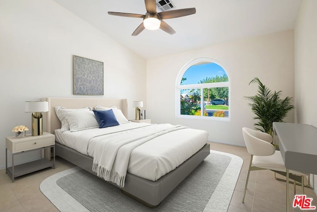 tiled bedroom with ceiling fan and lofted ceiling