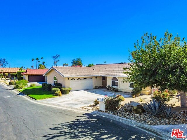 single story home with a garage