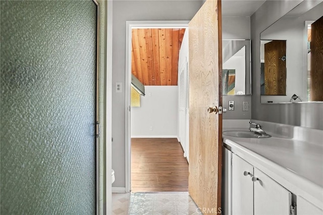 bathroom with vanity and hardwood / wood-style flooring